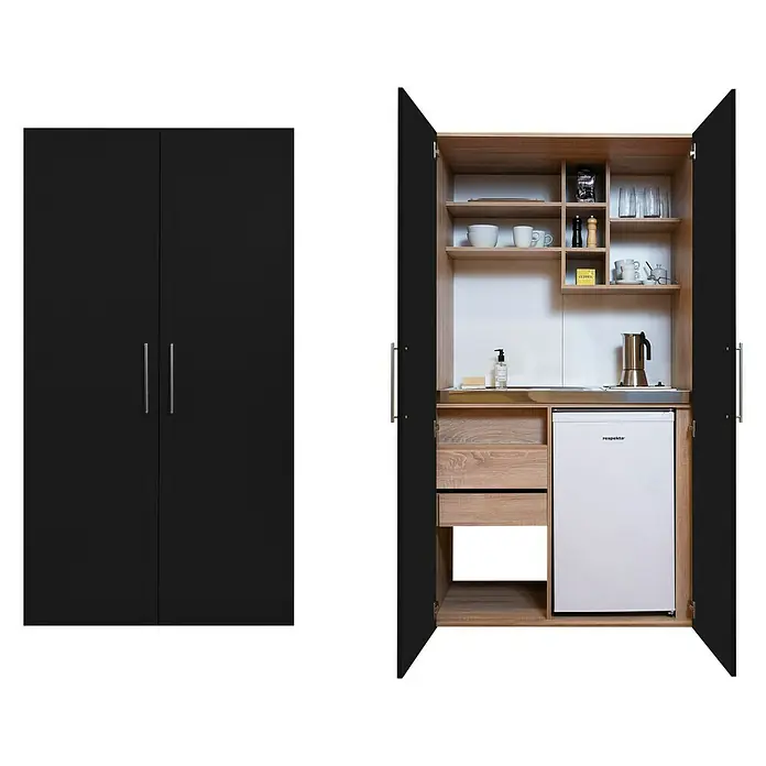 Respekta Schrankküche Peter - Breite: 104 cm, Schwarz/Eiche, Mit Glaskeramikkochfeld und Mikrowelle - Schrank mit integrierter Miniküche. Der Schrank besteht aus einem schwarzen Kleiderschrank und einer offenen Küchenzeile mit Regalen und Kühlschrank.