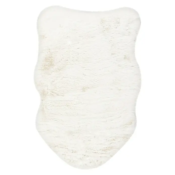 Kunstfell Happy - Ivory, 90 x 60 cm, 100 % Polyester (Flor) - Ein weicher, cremefarbener Teppich in ungewöhnlicher Form, ideal als dekoratives Element für gemütliche Wohnräume.