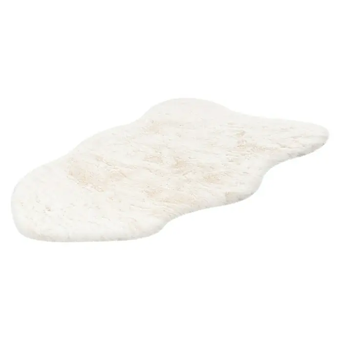 Kunstfell Happy - Ivory, 90 x 60 cm, 100 % Polyester (Flor) - Flauschiger, weißer Teppich in ungewöhnlicher Form. Der Teppich ist weich und lädt zum Betreten ein. Ideal für Wohn- oder Schlafzimmer.