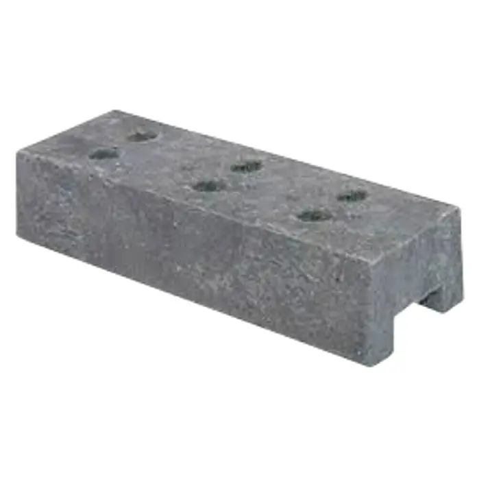 BHS Valencia Base de hormigón - Vallados - Un bloque de piedra gris con varios agujeros en la parte superior, perfecto para proyectos de construcción.
