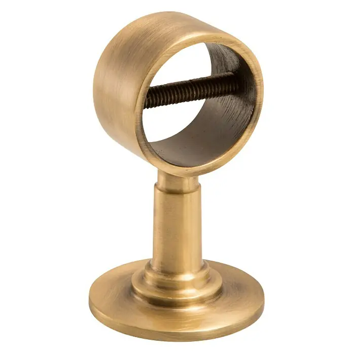 Stabilit Wandhalterung - L x B: 75 x 25 mm, Für Seildurchmesser: 30 mm, Bronziert - Nahaufnahme einer Gardinenstangenhalterung in gebürstetem Gold mit Schraube.