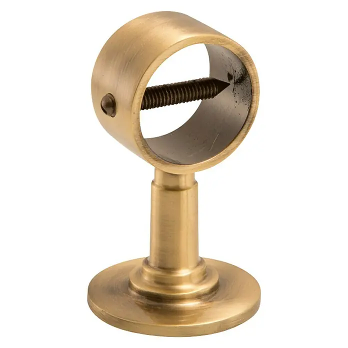 Stabilit Wandhalterung - L x B: 75 x 25 mm, Für Seildurchmesser: 30 mm, Bronziert - Nahaufnahme einer goldenen Gardinenstangenhalterung mit einer Stellschraube zur Fixierung der Gardinenstange, ideal für stilvolle Fensterdekorationen.