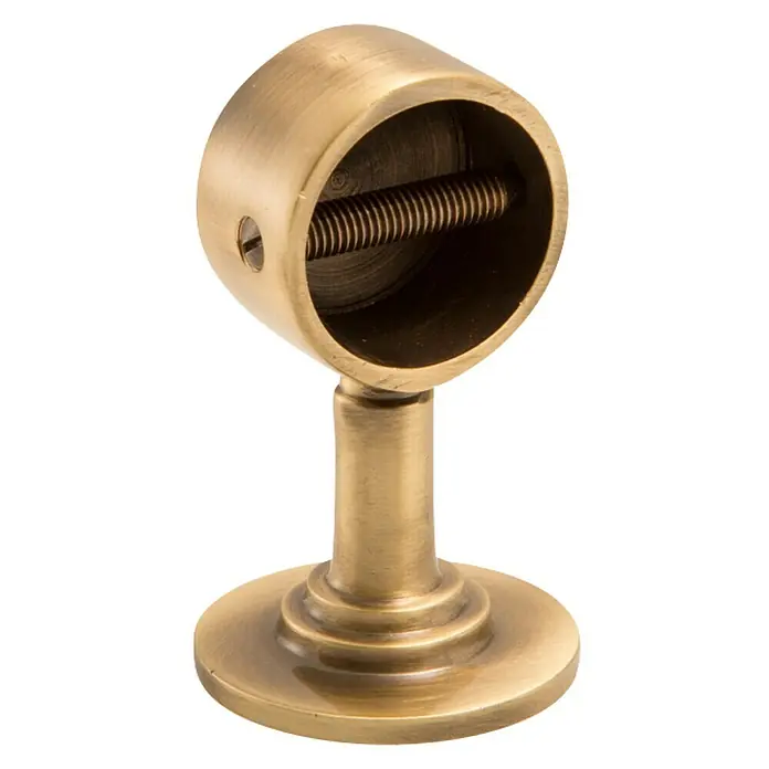 Stabilit Endhalterung - L x B: 75 x 30 mm, Für Seildurchmesser: 30 mm, Bronziert - Nahaufnahme einer goldenen Gardinenstangenhalterung mit Schraube zur Befestigung der Stange.