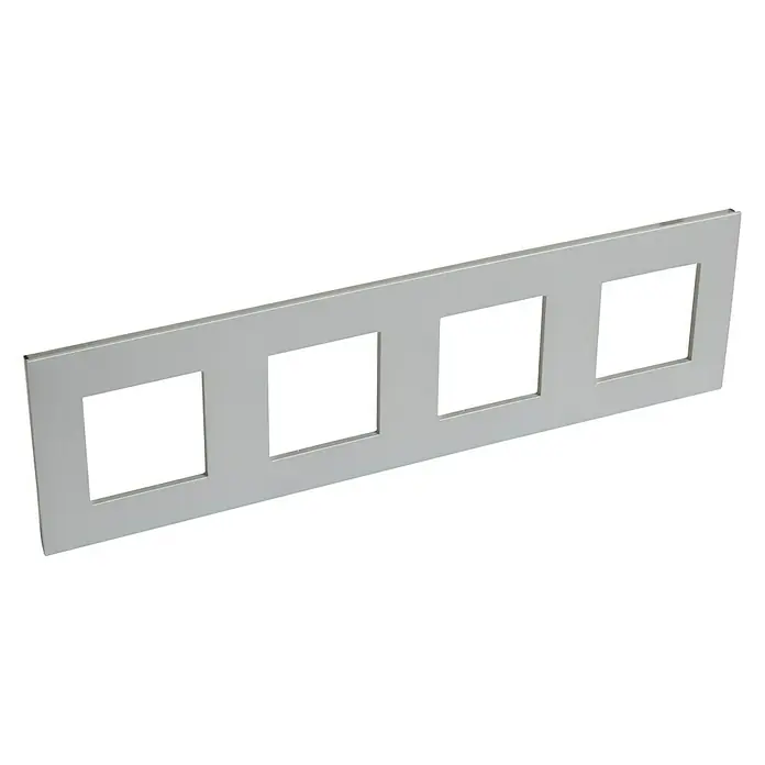 Legrand Valena Next Marco - Aluminio, Modelo de mecanismos: x 4, Plástico, Instalar - Imagen de una tapa alargada de color plateado con cuatro recortes cuadrados, posiblemente para interruptores o enchufes.