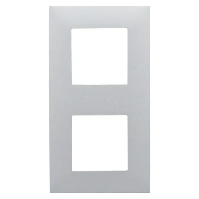 Legrand Valena Next Marco - Aluminio, Modelo de mecanismos: x 2, Plástico, Instalar - Una cubierta decorativa doble para interruptores de luz. La placa de pared presenta un acabado gris y dos aberturas cuadradas para los interruptores.