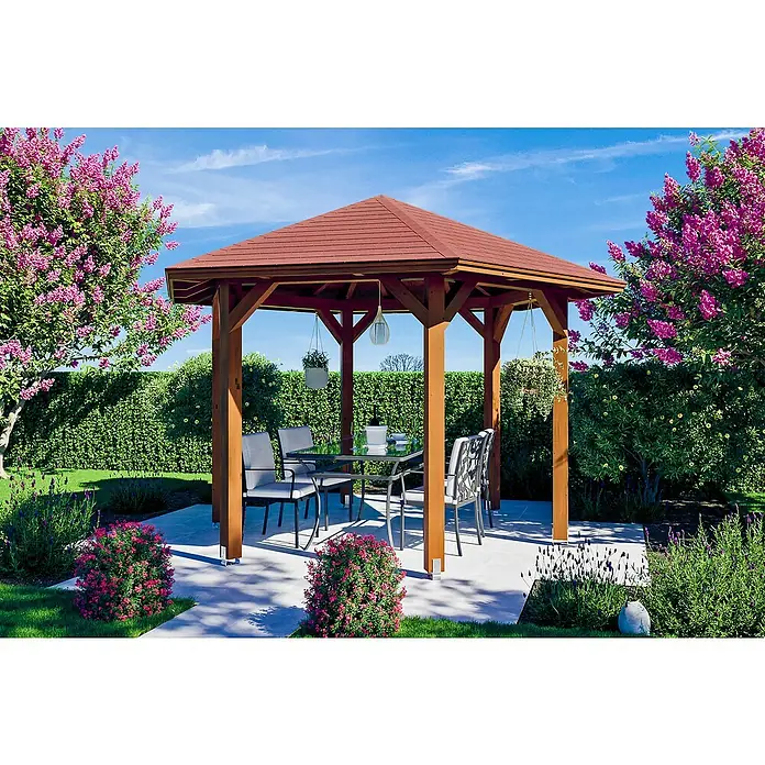 SKAN HOLZ Pavillon Nancy 2 - L x B: 364 x 420 cm, Nussbaum - Einladende Gartenlaube mit Holzdach und eleganten Gartenmöbeln, umgeben von üppigen Blumen und Grünpflanzen.