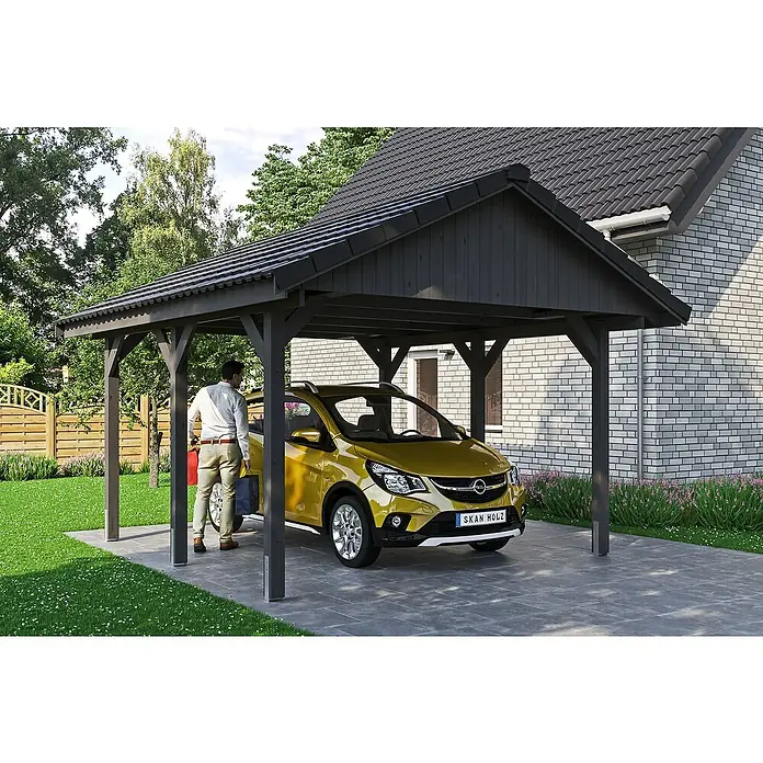 SKAN HOLZ Carport Wallgau - Außenmaß inkl. Dachüberstand (B x T): 4,3 x 5 m, Einzelcarport, Schiefergrau, Dachlatten zur Eindeckung mit Dachziegeln - Ein modernes Carport aus Holz mit einem gelben Auto darunter, das Schutz vor den Elementen bietet. Praktische und stilvolle Ergänzung für jedes Zuhause.