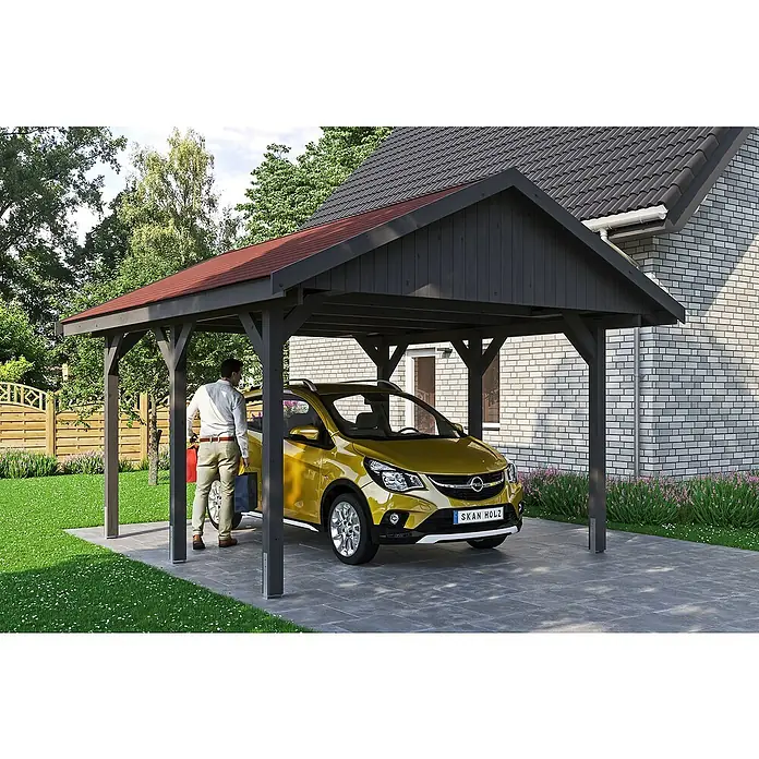 SKAN HOLZ Carport Wallgau - Außenmaß inkl. Dachüberstand (B x T): 4,3 x 5 m, Einzelcarport, Schiefergrau, Rote Bitumenschindeln - Ein Carport mit rotem Dach und grauem Rahmen schützt ein gelbes Auto, während ein Mann mit Einkaufstaschen daneben steht.
