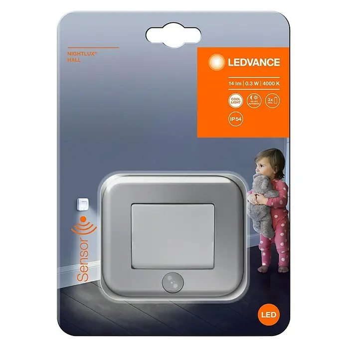 Osram Nightlux LED-Nachtlicht Hall - Silber, L x B x H: 8,4 x 7,3 x 2,2 cm - Bild einer LEDVANCE NIGHTLUX Hall Sensorleuchte in Verpackung, die für Flure geeignet ist und ein Kind zeigt.