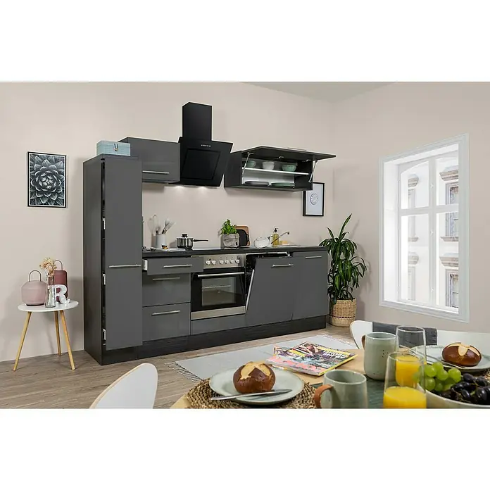 Respekta Premium Küchenzeile RP250EGCBO - Breite: 250 cm, Grau, Mit Elektrogeräten - Diese Abbildung zeigt eine moderne Küche mit grauen Schränken, einer Dunstabzugshaube und einem Esstisch mit Frühstück.
