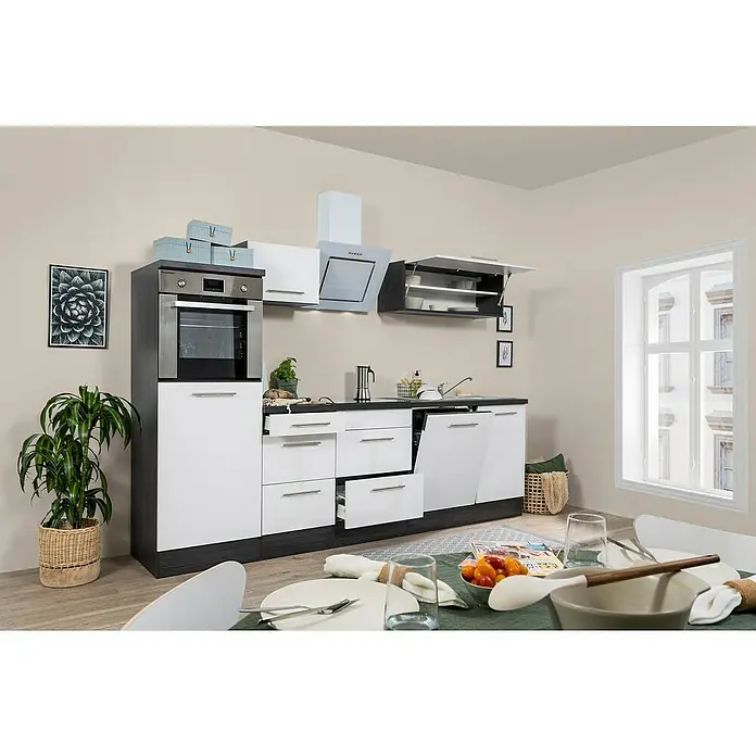 Respekta Premium Composición de cocina Amanda - Ancho: 280 cm, Roble/Blanco, Con electrodomésticos - Una cocina moderna en blanco y antracita con horno empotrado, cajones y armarios de pared, que ofrece un ambiente elegante para experiencias culinarias.