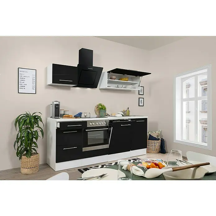 Respekta Premium Küchenzeile RP220WSCBO - Breite: 220 cm, Schwarz, Mit Elektrogeräten - Küchenansicht mit modernen schwarzen und weißen Schränken, einer Dunstabzugshaube und einem Esstisch mit Gedecken.