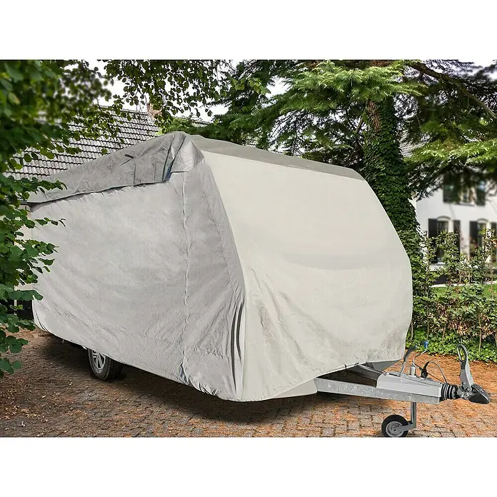 Calima Wohnwagen-Abdeckplane - L x B x H: 590 x 250 x 220 cm, Atmungsaktiv - Bild eines Wohnwagens mit einer grauen Schutzhülle. Ideal zum Schutz Ihres Wohnwagens vor Witterungseinflüssen.