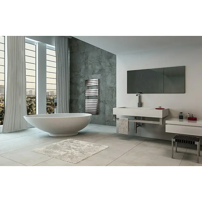 Cicsa Radiador toallero eléctrico Pukita - An x Al: 50 x 78,8 cm, Plateado, Toallero - Baño con un moderno toallero radiador de acero inoxidable. El toallero está montado en una pared gris.