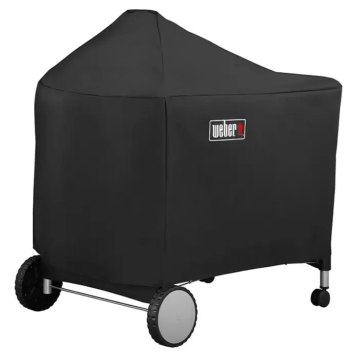 Weber Funda Performer 57 cm - Weber Performer con Ø 57 cm - Imagen de una funda para barbacoa Weber en negro. La funda protege la barbacoa del clima y el polvo, y presenta el logo de Weber.