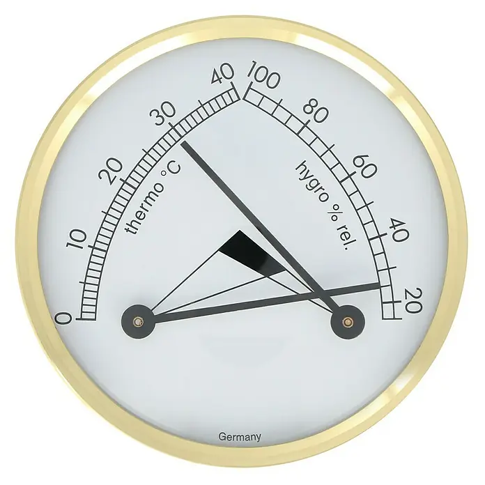 TFA Dostmann Thermo-Hygrometer - 7 cm - Ein rundes Hygrometer mit goldfarbenem Rahmen, das Temperatur und Luftfeuchtigkeit anzeigt.