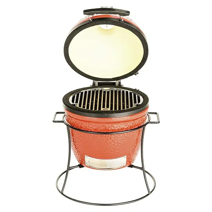 Kamado Joe Grillrost - Durchmesser: 35 cm, Gusseisen - Nahaufnahme eines roten Kamado-Grills mit offenem Deckel auf einem Metallständer, ideal zum Grillen im Freien.