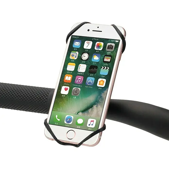 Smartphone-Fahrradhalterung mit Sportarmband - Schwarz - Ein iPhone, das mit einem schwarzen Silikonband an einem Fahrradlenker befestigt ist, zeigt den Startbildschirm mit Apps.
