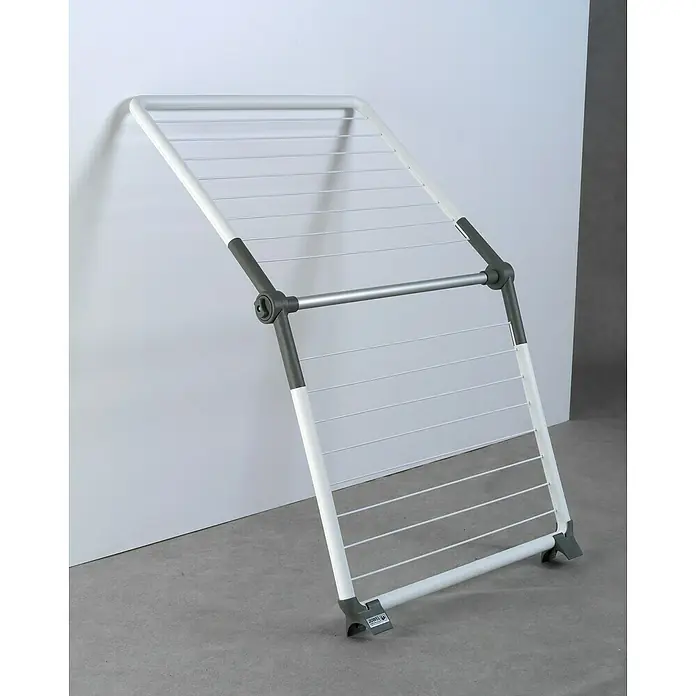 Juwel Stand-Wäscheständer SuperDry Wing - Länge Wäscheleine: 8,8 m, L x B x H: 103,1 x 60,1 x 7,1 cm, Weiß/Obsidian Grey - Wäscheständer aus Metall in Weiß und Grau vor einer Wand. Ideal zum Trocknen von Kleidung im Innenbereich.