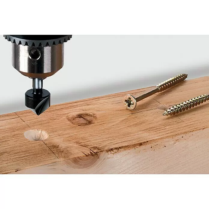Wolfcraft Kegelsenker - Durchmesser: 16 mm, Stahl, Rundschaft - Senkbohrer erzeugt Loch in Holz, daneben zwei goldene Holzschrauben, eine mit Sternantrieb.