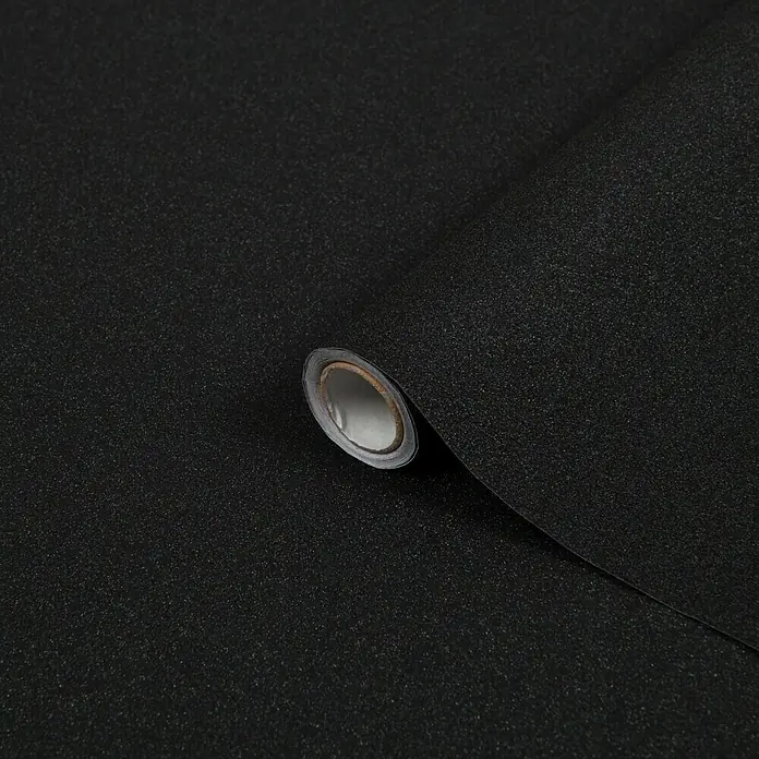 D-c-fix Metalleffektfolie Metallic Glitter - 200 x 67,5 cm, Schwarz/Glitzer, Selbstklebend - Nahaufnahme einer Rolle schwarzer, selbstklebender Möbelfolie mit feiner Textur, ideal für DIY-Projekte und Renovierungen.