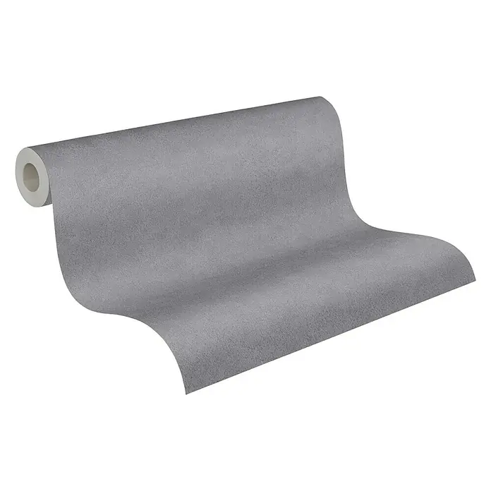 A.S. Création Elements Vliestapete - Dunkelgrau, Uni, 10,05 x 0,53 m - Abgerollte graue Tapetenrolle auf schwarzem Hintergrund, die Textur und Schattierung des Produkts hervorhebt.
