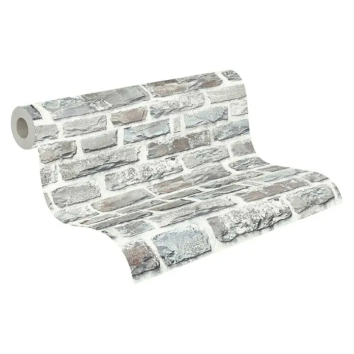 A.S. Création Elements Vliestapete Steine - Grau/Creme, Steinoptik, 10,05 x 0,53 m - Nahaufnahme einer Rolle grauer Backstein-Tapete, die eine moderne und rustikale Note für die Inneneinrichtung bietet.