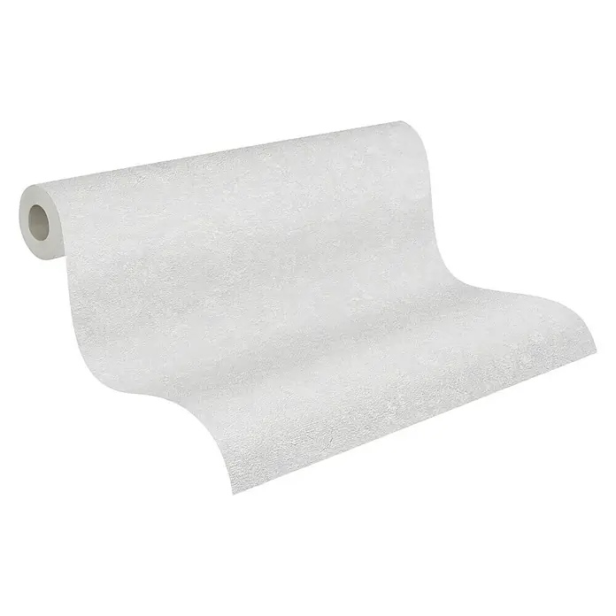 A.S. Création Industrial Vliestapete - Hellgrau, Uni, 10,05 x 0,53 m - Eine Rolle weiße Tapete, die auf einer schwarzen Oberfläche aufgerollt ist, wobei die Textur des Materials sichtbar ist.