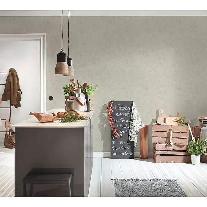 A.S. Création Elements Vliestapete - Grau/Beige, Betonoptik, 10,05 x 0,53 m - Helle, leicht strukturierte Tapete in Grau an einer Küchenwand, die einen modernen, neutralen Hintergrund bildet.