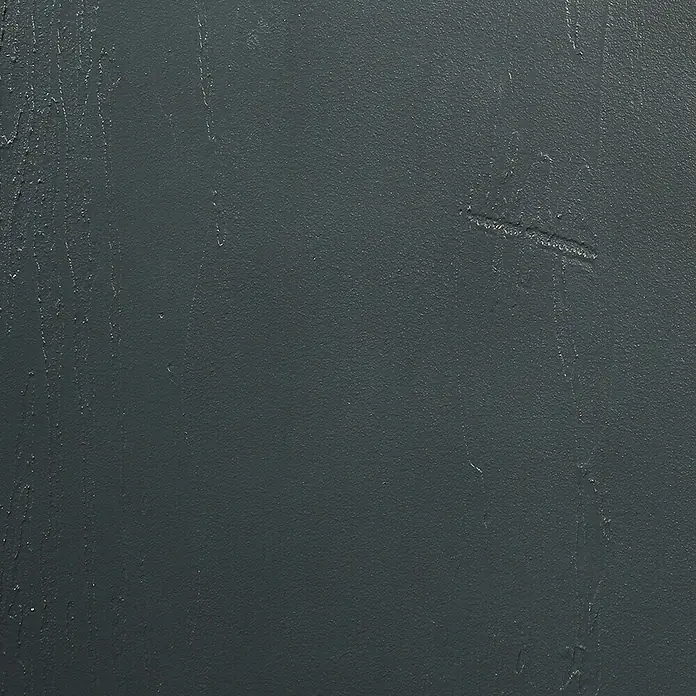 SCHÖNER WOHNEN-Farbe Betondesign-Optik Dekoputz-Set - 3 -tlg., Anthrazit - Nahaufnahme einer dunkelgrauen, strukturierten Oberfläche, die Tiefe und Textur betont.\n