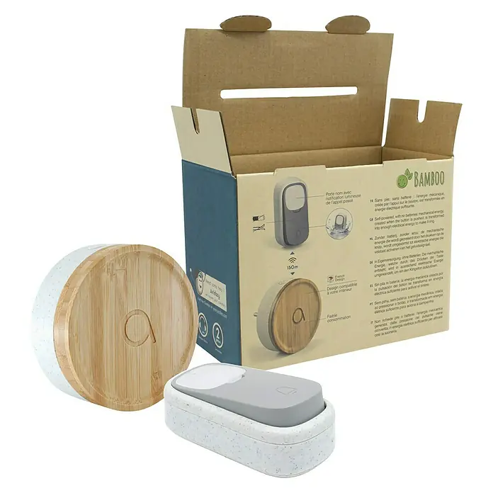 Avidsen Türklingel Bamboo - Netzbetrieben, Bambus/Grau, 70 x 80 x 80 mm - Produktbild einer kabellosen Türklingel von Bamboo mit Holzoberfläche und passender Empfängerbox, verpackt im Karton.