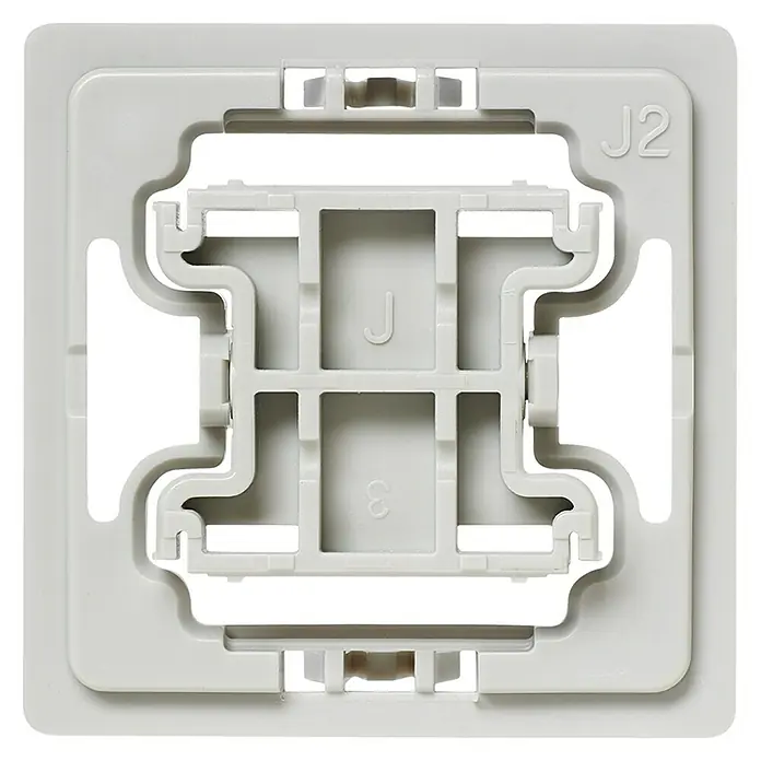 Homematic IP Adapter EQ3-ADA-J2 - 20 Stk., Passend für: Jung-Schalter A 500/A creation/A plus/AS 500/AS universal - Nahaufnahme einer weißen quadratischen Montageplatte mit einer gitterartigen Öffnung in der Mitte und der Kennzeichnung "J2".