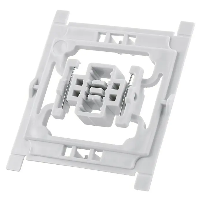 Homematic IP Adapter EQ3-ADA-S - 20 Stk., Passend für: Siemens Schalter DELTA miro/DELTA line/DELTA style - Nahaufnahme einer weißen elektrischen Gerätehalterung mit einem zentralen Anschlussstück, ideal für Elektronikprojekte.