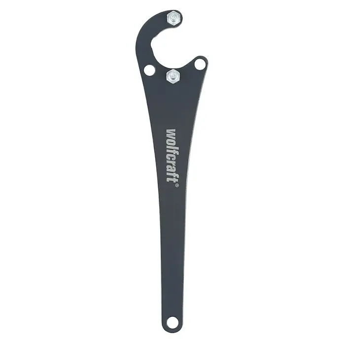 Wolfcraft Flanschschlüssel - Stahl - Das Bild zeigt einen schwarzen Wolfcraft Hakenschlüssel mit silberner Beschriftung und zwei Schrauben. Das Werkzeug ist für spezielle Anwendungen konzipiert.