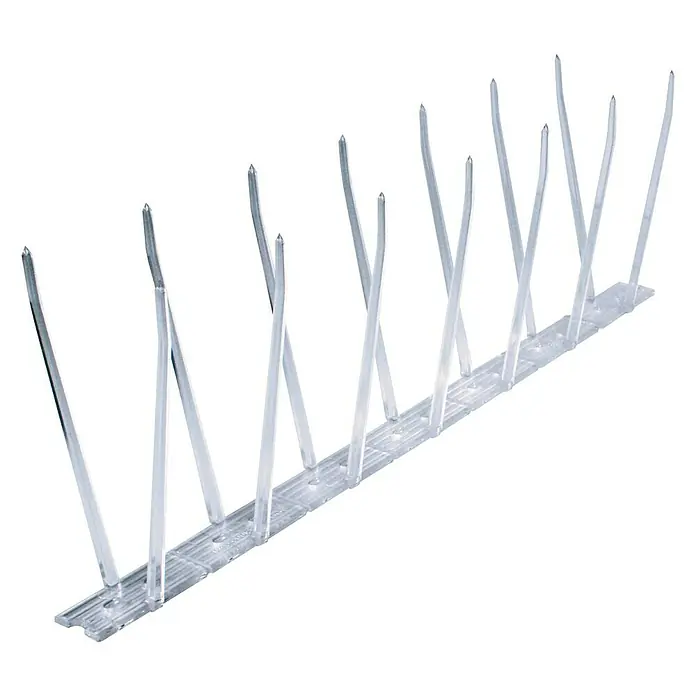 Swissinno Natural Control Taubenabwehr-Spikes - Länge: 300 cm, 9 Streifen, inkl. Kleber - Nahaufnahme einer Reihe von transparenten Vogelabwehrspitzen auf einer schwarzen Oberfläche.