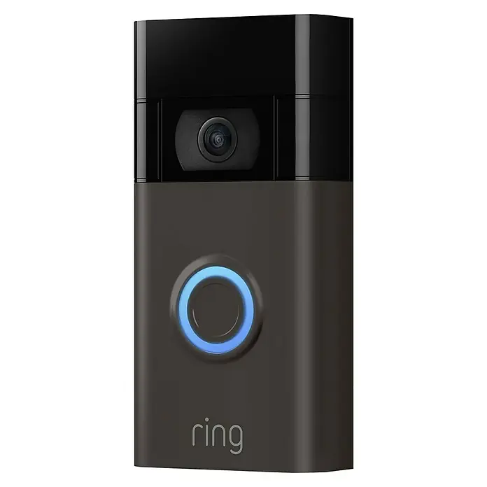 Ring Timbre con cámara Video Doorbell - Bronce - Primer plano de un timbre Ring con cámara y botón iluminado en azul, que combina seguridad y tecnología moderna.