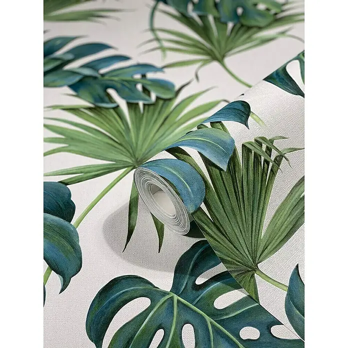 SCHÖNER WOHNEN-Kollektion New Spirit Vliestapete Fensterblatt - Grün/Weiß, Floral, 10,05 x 0,53 m - Nahaufnahme einer tropischen Blattmuster-Tapete auf einer Rolle, die lebendige grüne und blaue Farbtöne aufweist.