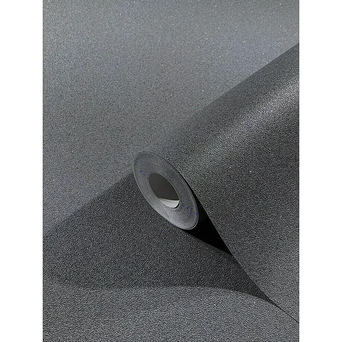 SCHÖNER WOHNEN-Kollektion New Spirit Vliestapete - Dunkelgrau, Uni, 10,05 x 0,53 m - Nahaufnahme einer Rolle strukturierten schwarzen Vinyltapeten, die die Textur und das Design hervorhebt.