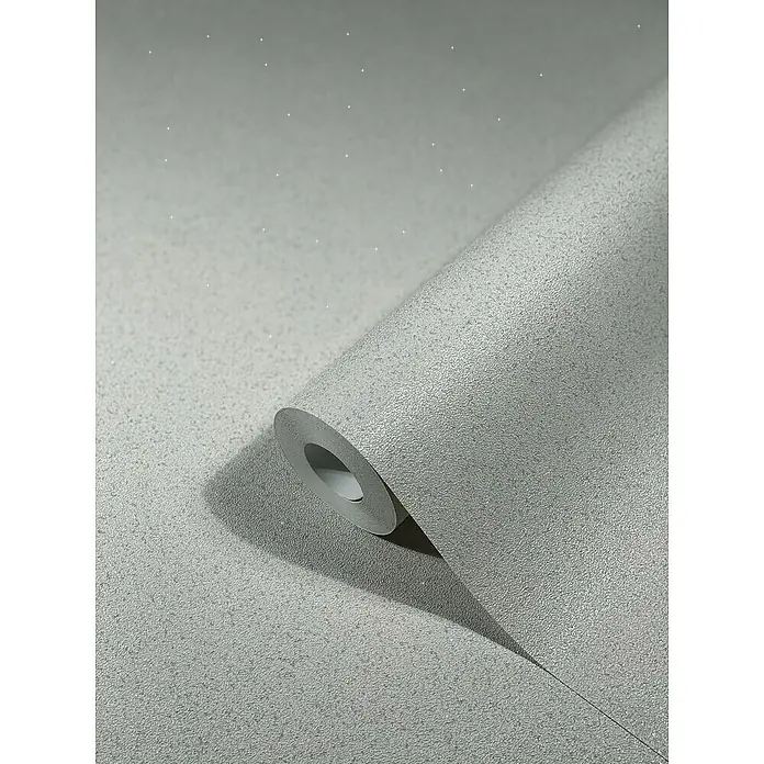 SCHÖNER WOHNEN-Kollektion New Spirit Vliestapete - Hellbeige, Uni, 10,05 x 0,53 m - Nahaufnahme einer Rolle silberner, strukturierter Tapete, die eine subtile Eleganz und einen modernen Touch für die Inneneinrichtung verspricht.