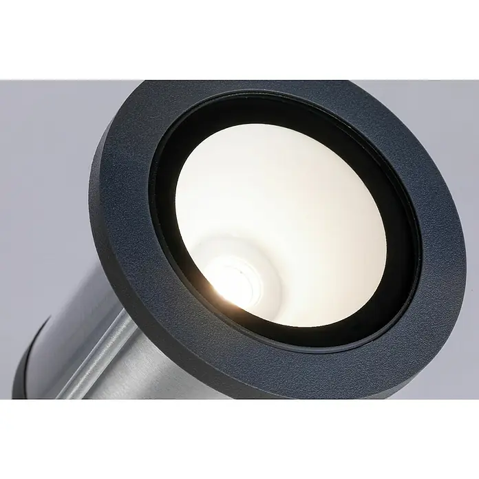 Paulmann Plug & Shine LED-Gartenstrahler Spot - Ø x H: 8,8 x 26,5 cm, Anthrazit, 5,1 W, IP65 - Nahaufnahme einer runden, eingelassenen Leuchte mit blaugrauem Rahmen und hellem Licht im Inneren.