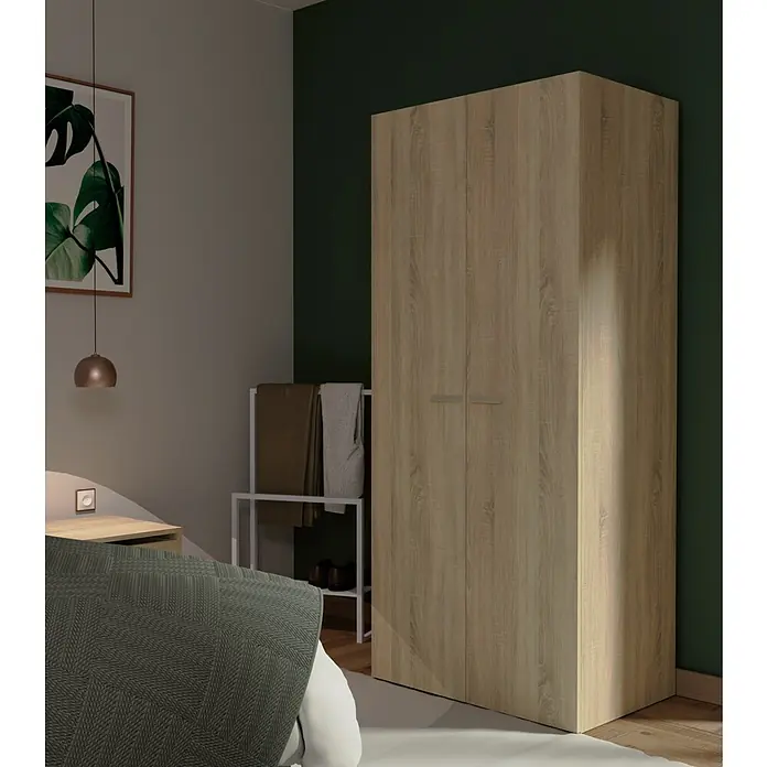 Muebles Pitarch Tibet Armario para ropa y zapatero - Roble - Escena de dormitorio con un gran armario de aspecto de madera que ofrece almacenamiento y estilo.