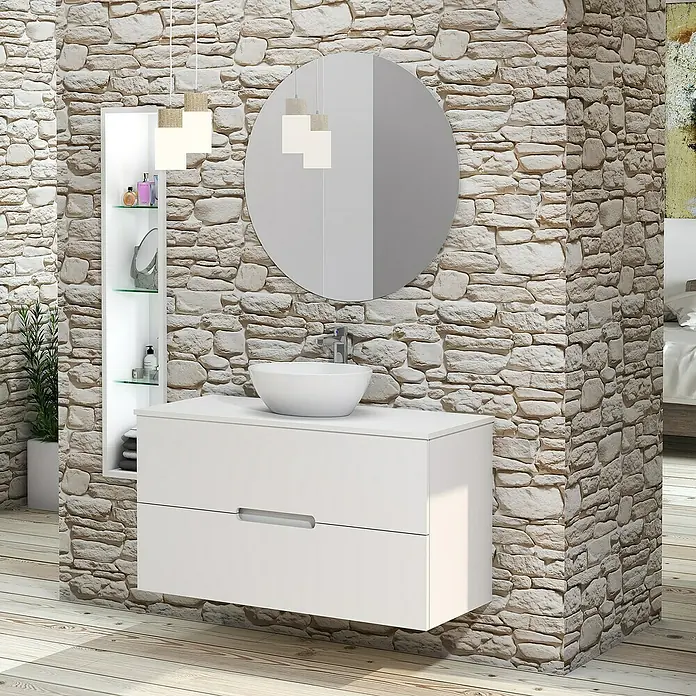 Artysan Conjunto de mueble de baño Loop Top - Ancho: 100 cm, 4 pzs., Blanco, Mate - Interior de baño moderno con tocador blanco, espejo redondo y pared de piedra. El diseño minimalista crea un ambiente elegante.