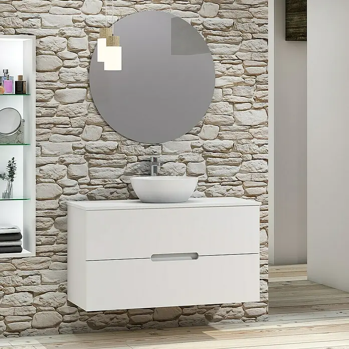 Artysan Conjunto de mueble de baño Loop Top - Ancho: 100 cm, 4 pzs., Blanco, Mate - Elegante interior de baño con un moderno tocador blanco y espejo redondo sobre una pared de piedra.