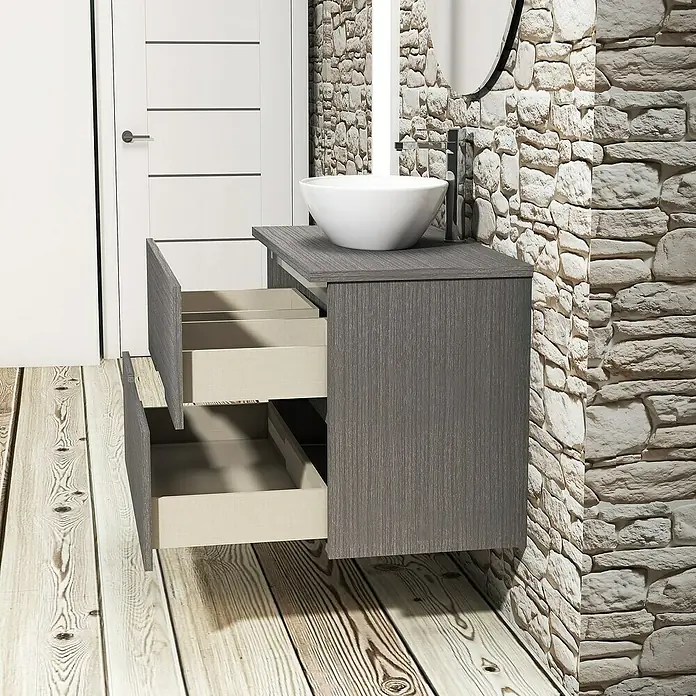 Artysan Conjunto de mueble de baño Loop Top - Ancho: 80 cm, 4 pzs., Ceniza, Mate - Mueble de baño gris con cajones abiertos, complementado con un lavabo redondo y grifo frente a pared de piedra rústica.