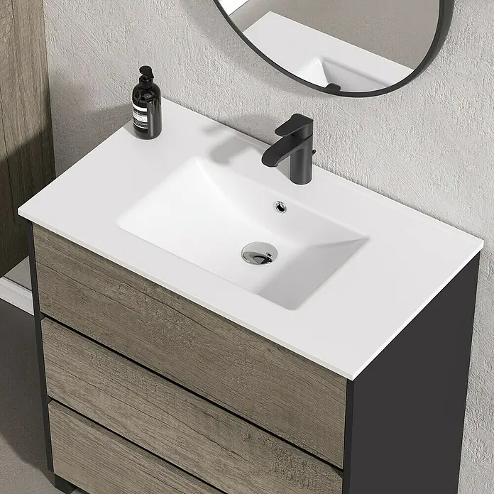 Artysan Conjunto de mueble de baño Africa - Ancho: 80 cm, 3 pzs., Nebraska, Mate - Toma de ángulo alto de un tocador de baño con cajones de madera gris y un lavabo blanco, complementado con un grifo negro.