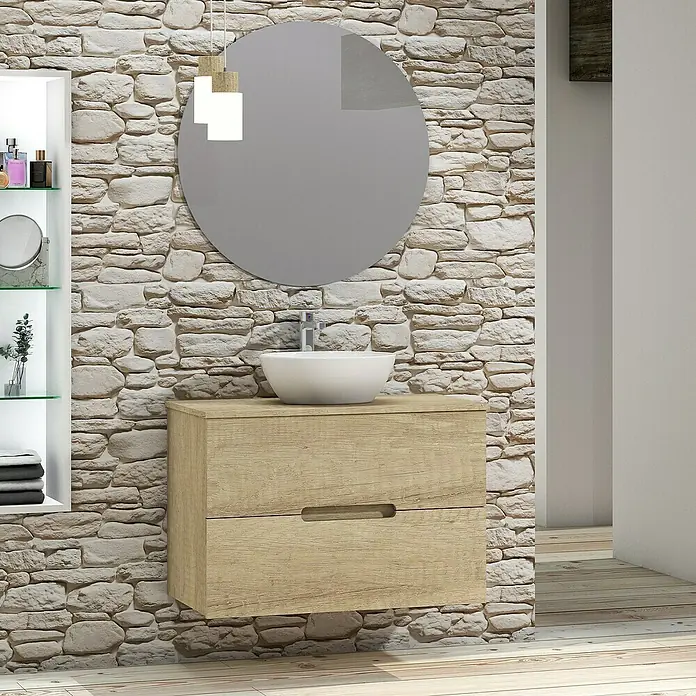 Artysan Conjunto de mueble de baño Loop Top - Ancho: 80 cm, 4 pzs., Nature, Mate - Un tocador de baño con dos cajones, un espejo redondo y un lavabo en un baño moderno con pared de piedra.