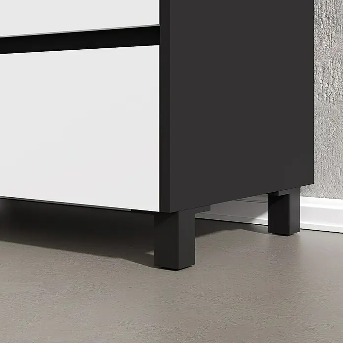 Artysan Conjunto de mueble de baño Africa - Ancho: 60 cm, 3 pzs., Blanco, Mate - Cómoda blanca y negra con patas rectangulares. El mueble está colocado sobre un piso gris liso frente a un zócalo blanco.