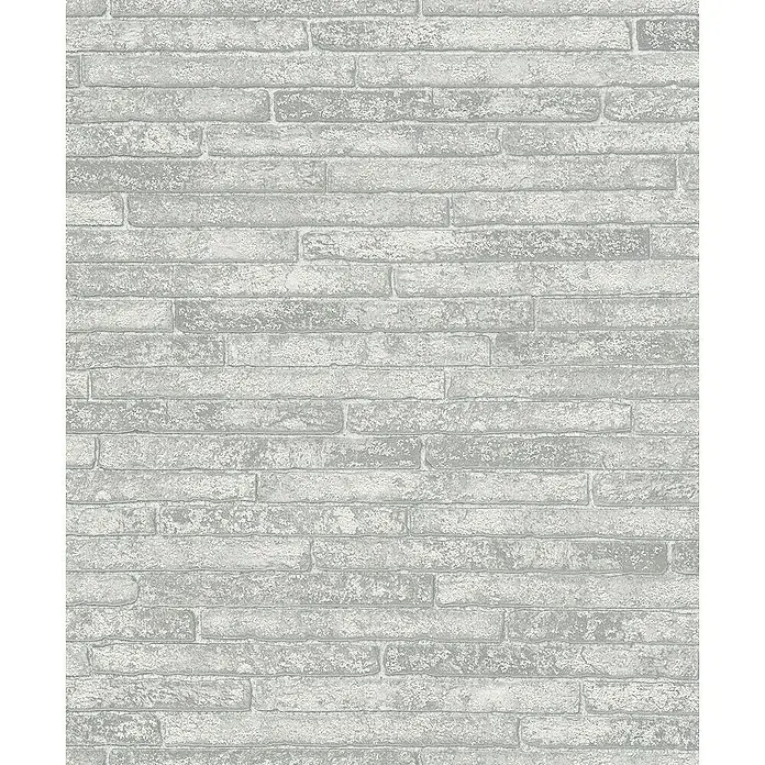 Marburg Sand & Stones Vliestapete Steinmauer I - Hellgrau, Steinoptik, 10,05 x 0,53 m - Nahaufnahme einer weißen Ziegelwand, die eine rustikale und elegante Textur für dekorative Wandverkleidungen bietet.