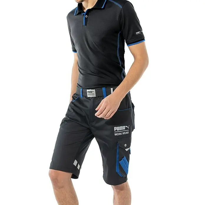 Puma Workwear Arbeitshose Champ - Konfektionsgröße: 50, Carbon/Blau, Gartenbauarbeiten - Schwarzes Puma Workwear-Polohemd und Shorts mit blauen Akzenten für einen stilvollen und funktionellen Look.