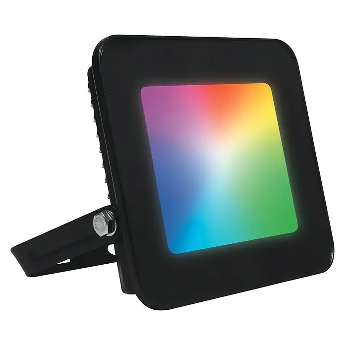 Muvit iO Foco de jardín LED - 20 W, Negro, IP65, LED - La imagen muestra un foco LED RGB con una carcasa negra y una superficie de iluminación colorida.